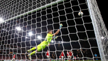 LONDON, ENGLAND - OCTOBER 24: Nicolas Pepe of Arsenal scores his team's third goal past Miguel Silva of Vitoria Guimaraes during the UEFA Europa League group F match between Arsenal FC and Vitoria Guimaraes at Emirates Stadium on October 24, 2019 in London, United Kingdom. (Photo by Bryn Lennon/Getty Images)
