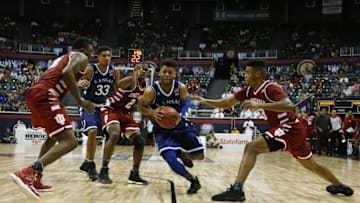 Nov 11, 2016; Honolulu, HI, USA; Kansas Jayhawks guard Frank Mason III (0) drives to the basket past Indiana Hoosiers guard Josh Newkirk (2) at the Stan Sheriff Center. Indiana defeats Kansas 103-99 in overtime. Mandatory Credit: Brian Spurlock-USA TODAY Sports