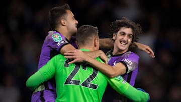 WOLVERHAMPTON, ENGLAND - SEPTEMBER 22: Sergio Reguilón, goalkeeper Pierluigi Gollini and Bryan Gil of Tottenham Hotspur celebrate after winning the penalty shoot out during the Carabao Cup Third Round match between Wolverhampton Wanderers and Tottenham Hotspur at Molineux on September 22, 2021 in Wolverhampton, England. (Photo by Visionhaus/Getty Images)