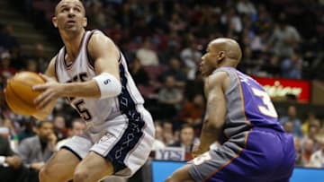 UNITED STATES - DECEMBER 09: New Jersey Nets' Jason Kidd readies himself to take a shot while guarded by Phoenix Suns' Stephon Marbury during game action at Continental Airlines Arena. Kidd led the scoring with 20 points as the Nets beat the Suns, 106-93. (Photo by Keith Torrie/NY Daily News Archive via Getty Images)
