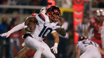 SALT LAKE CITY, UT- OCTOBER 12 : Quarterback Jamarye Joiner #10 of the Arizona Wildcats is chased out of the pocket during their game against the Utah Utes at Rice Eccles Stadium on October 12, 2018 in Salt Lake City , Utah. (Photo by Chris Gardner/Getty Images)