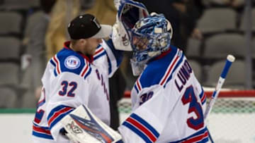 Dec 15, 2016; Dallas, TX, USA; New York Rangers goalie Antti Raanta (32) and goalie Henrik Lundqvist (30) celebrate the win over the Dallas Stars at the American Airlines Center. The Rangers shut out the Stars 2-0. Mandatory Credit: Jerome Miron-USA TODAY Sports