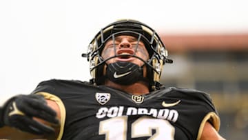 BOULDER, CO - NOVEMBER 20: Linebacker Quinn Perry #12 of the Colorado Buffaloes celebrates a defensive play against the Washington Huskies at Folsom Field on November 20, 2021 in Boulder, Colorado. (Photo by Dustin Bradford/Getty Images)