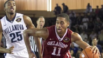 Dec 7, 2015; Honolulu, HI, USA; Oklahoma Sooners guard Isaiah Cousins (11) gets around Villanova Wildcats forward/guard Mikal Bridges (25) during the second half of the NCAA basketball game at Bloch Arena. Oklahoma defeated Villanova 78-55. Mandatory Credit: Marco Garcia-USA TODAY Sports