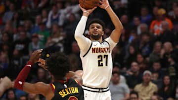 DENVER, COLORADO - JANUARY 11: Jamal Murray #27 of the Denver Nuggets puts up a shot against Collin Sexton #2 of the Cleveland Cavaliers in the second quarter at the Pepsi Center on January 11, 2020 in Denver, Colorado. NOTE TO USER: User expressly acknowledges and agrees that, by downloading and or using this photograph, User is consenting to the terms and conditions of the Getty Images License Agreement. (Photo by Matthew Stockman/Getty Images)