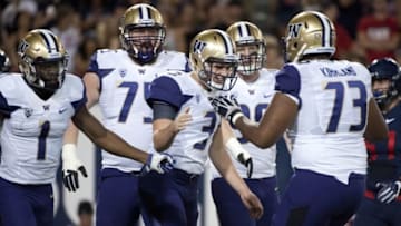 Sep 24, 2016; Tucson, AZ, USA; Washington Huskies quarterback Jake Browning (3) and offensive lineman Andrew Kirkland (73) high five after scoring against the Arizona Wildcats during the second quarter at Arizona Stadium. Mandatory Credit: Casey Sapio-USA TODAY Sports