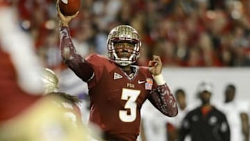 Jan 1, 2013; Miami Gardens, FL, USA; Florida State Seminoles quarterback EJ Manuel (3) passes in the second quarter of the game against the Northern Illinois Huskies at the 2013 Orange Bowl at Sun Life Stadium. Mandatory Credit: Ron Chenoy-USA TODAY Sports