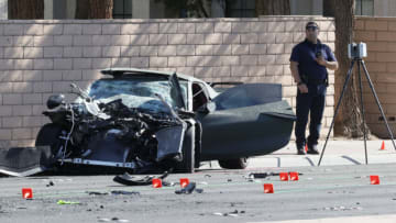 LAS VEGAS, NEVADA - NOVEMBER 02: A Las Vegas Metropolitan Police Department crime scene investigator stands next to a Chevrolet Corvette involved in an accident on November 2, 2021 in Las Vegas, Nevada. Police said wide receiver Henry Ruggs III of the Las Vegas Raiders was driving the Corvette when it hit another vehicle killing a woman. Ruggs will be charged with DUI resulting in death. (Photo by Ethan Miller/Getty Images)
