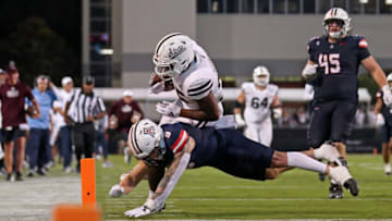 STARKVILLE, MISSISSIPPI - SEPTEMBER 09: Gunner Maldonado #9 of the Arizona Wildcats tackles Jeffery Pittman #25 of the Mississippi State Bulldogs during the second half at Davis Wade Stadium on September 09, 2023 in Starkville, Mississippi. (Photo by Justin Ford/Getty Images)