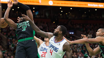 BOSTON, MA - FEBRUARY 9: Jaylen Brown #7 of the Boston Celtics is fouled by JaMychal Green #4 of the Los Angeles Clippers at TD Garden on February 9, 2019 in Boston, Massachusetts. NOTE TO USER: User expressly acknowledges and agrees that, by downloading and or using this photograph, User is consenting to the terms and conditions of the Getty Images License Agreement. (Photo by Kathryn Riley/Getty Images)