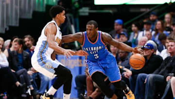 Apr 5, 2016; Denver, CO, USA; Denver Nuggets guard Gary Harris (14) defends against Oklahoma City Thunder guard Dion Waiters (3) in the first quarter at the Pepsi Center. Mandatory Credit: Isaiah J. Downing-USA TODAY Sports