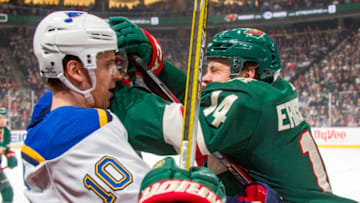 ST. PAUL, MN - FEBRUARY 27: Joel Eriksson Ek #14 of the Minnesota Wild and Brayden Schenn #10 of the St. Louis Blues battle for the puck during the game at the Xcel Energy Center on February 27, 2018 in St. Paul, Minnesota. (Photo by Bruce Kluckhohn/NHLI via Getty Images)