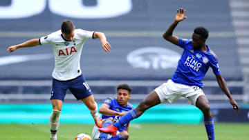 LONDON, ENGLAND - JULY 19: Giovani Lo Celso of Tottenham Hotspur battles for possession with Wilfred Ndidi of Leicester City during the Premier League match between Tottenham Hotspur and Leicester City at Tottenham Hotspur Stadium on July 19, 2020 in London, England. Football Stadiums around Europe remain empty due to the Coronavirus Pandemic as Government social distancing laws prohibit fans inside venues resulting in all fixtures being played behind closed doors. (Photo by Richard Heathcote/Getty Images)