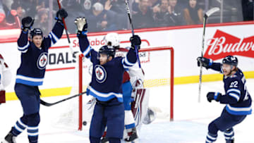 Apr 24, 2022; Winnipeg, Manitoba, CAN; Winnipeg Jets center Adam Lowry (17) celebrates his third period goal against the Colorado Avalanche at Canada Life Centre. Mandatory Credit: James Carey Lauder-USA TODAY Sports