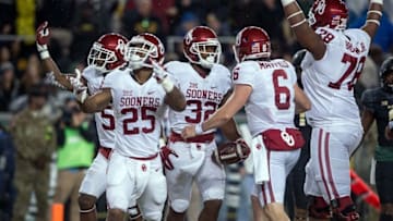 Nov 14, 2015; Waco, TX, USA; Oklahoma Sooners wide receiver Sterling Shepard (3) and running back Joe Mixon (25) and running back Samaje Perine (32) and quarterback Baker Mayfield (6) celebrate Perine