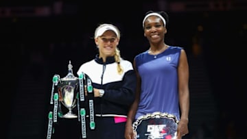 SINGAPORE - OCTOBER 29: Winner Caroline Wozniacki of Denmark celebrates victory with the Billie Jean King trophy and runner up Venus Williams of the United States after the Singles Final during day 8 of the BNP Paribas WTA Finals Singapore presented by SC Global at Singapore Sports Hub on October 29, 2017 in Singapore. (Photo by Clive Brunskill/Getty Images)