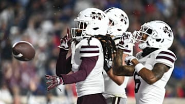 Nov 24, 2022; Oxford, Mississippi, USA; Mississippi State Bulldogs wide receiver Lideatrick Griffin (5) reacts with teammates after a touchdown against the Ole Miss Rebels during the second quarter at Vaught-Hemingway Stadium. Mandatory Credit: Matt Bush-USA TODAY Sports