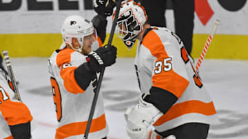 Oct 20, 2021; Philadelphia, Pennsylvania, USA; Philadelphia Flyers right wing Cam Atkinson (89) and goaltender Martin Jones (35) celebrate win against the Boston Bruins at Wells Fargo Center. Mandatory Credit: Eric Hartline-USA TODAY Sports