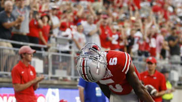 Ohio State wide receiver Garrett Wilson celebrates his12-yard touchdown catch in the fourth quarter Saturday.Tulsa At Ohio State Football