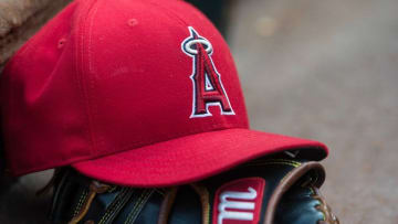 Jul 3, 2015; Arlington, TX, USA; A view of a Los Angeles Angels baseball hat and glove and logo before the game between the Texas Rangers and the Los Angeles Angels at Globe Life Park in Arlington. The Angels defeated the Rangers 8-2. Mandatory Credit: Jerome Miron-USA TODAY Sports