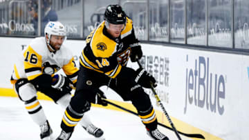 BOSTON, MASSACHUSETTS - JANUARY 28: Jason Zucker #16 of the Pittsburgh Penguins defends Chris Wagner #14 of the Boston Bruins during the second period at TD Garden on January 28, 2021 in Boston, Massachusetts. (Photo by Maddie Meyer/Getty Images)