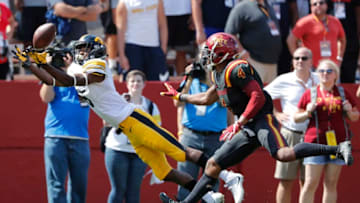 AMES, IA - SEPTEMBER 9: Wide receiver Ihmir Smith-Marsette #6 of the Iowa Hawkeyes pulls in a touchdown pass as defensive back Evrett Edwards #4 of the Iowa State Cyclones defends in the second half of play at Jack Trice Stadium on September 9, 2017 in Ames, Iowa. The Iowa Hawkeyes won 44-41 over the Iowa State Cyclones. (Photo by David Purdy/Getty Images)
