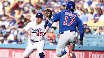 LOS ANGELES, CALIFORNIA - JUNE 15: Matt Beaty #45 of the Los Angeles Dodgers gets the forced out at first base on Kris Bryant #17 of the Chicago Cubs during the first inning of the MLB game at Dodger Stadium on June 15, 2019 in Los Angeles, California. (Photo by Victor Decolongon/Getty Images)
