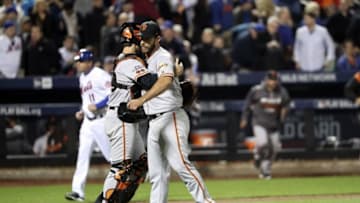 Oct 5, 2016; New York City, NY, USA; San Francisco Giants starting pitcher Madison Bumgarner (right) and catcher Buster Posey (left) celebrate the win against the New York Mets in the National League wild card playoff baseball game at Citi Field. Mandatory Credit: Anthony Gruppuso-USA TODAY Sports