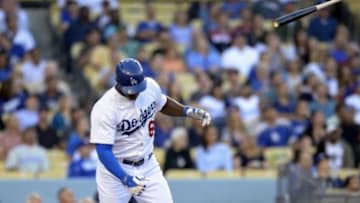 Jun 16, 2014; Los Angeles, CA, USA; Los Angeles Dodgers right fielder Yasiel Puig (66) flips the bat on a pop out in the first inning against the Colorado Rockies at Dodger Stadium. Mandatory Credit: Robert Hanashiro-USA TODAY Sports