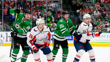 Jan 28, 2022; Dallas, Texas, USA; Dallas Stars left wing Roope Hintz (24) and defenseman Ryan Suter (20) and Washington Capitals center Nic Dowd (26) and right wing Garnet Hathaway (21) in action during the game between the Washington Capitals and the Dallas Stars at the American Airlines Center. Mandatory Credit: Jerome Miron-USA TODAY Sports