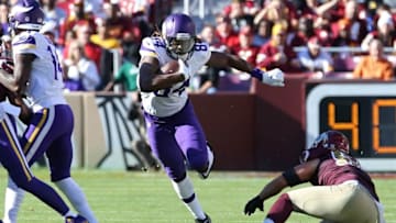 Nov 13, 2016; Landover, MD, USA; Minnesota Vikings wide receiver Cordarrelle Patterson (84) runs with the ball past Washington Redskins linebacker Will Compton (51) in the first quarter at FedEx Field. Mandatory Credit: Geoff Burke-USA TODAY Sports