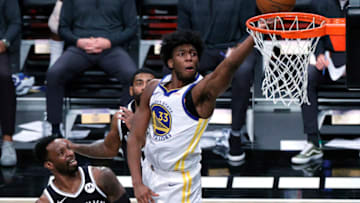 NEW YORK, NEW YORK - DECEMBER 22: James Wiseman #33 of the Golden State Warriors attempts a layup against Jeff Green #8 and Kyrie Irving #11 of the Brooklyn Nets during the first half at Barclays Center on December 22, 2020 in the Brooklyn borough of New York City. NOTE TO USER: User expressly acknowledges and agrees that, by downloading and/or using this photograph, user is consenting to the terms and conditions of the Getty Images License Agreement. (Photo by Sarah Stier/Getty Images)