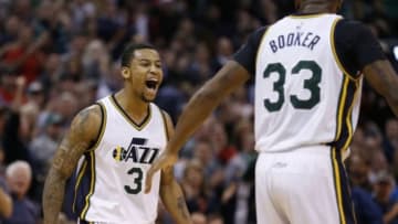 Dec 11, 2015; Salt Lake City, UT, USA; Utah Jazz guard Trey Burke (3) and forward Trevor Booker (33) reacts after a play in the fourth quarter at EnergySolutions Arena. Mandatory Credit: Jeff Swinger-USA TODAY Sports