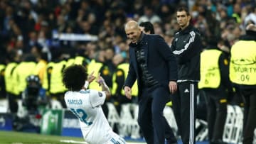 MADRID, SPAIN - FEBRUARY 14: Marcelo of Real Madrid celebrates scoring the 3rd Real Madrid goal with Zinedine Zidane of Real Madrid during the UEFA Champions League Round of 16 First Leg match between Real Madrid and Paris Saint-Germain at Bernabeu on February 14, 2018 in Madrid, Spain. (Photo by Gonzalo Arroyo Moreno/Getty Images)