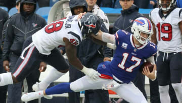 Bills quarterback Josh Allen is tackled by Texans Joe Thomas but not after gaining a first down.Jg 100321 Bills 6