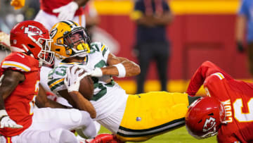 Aug 25, 2022; Kansas City, Missouri, USA; Green Bay Packers wide receiver Samori Toure (83) is tackled by Kansas City Chiefs cornerback Dicaprio Bootle (2) and Kansas City Chiefs safety Bryan Cook (6) during the first half at GEHA Field at Arrowhead Stadium. Mandatory Credit: Jay Biggerstaff-USA TODAY Sports