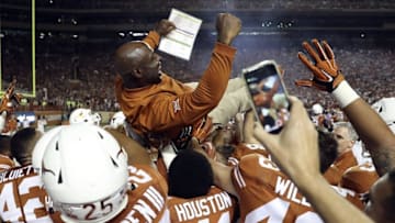 Sep 4, 2016; Austin, TX, USA; Texas Longhorns players lift up head coach Charlie Strong after the victory against the Notre Dame Fighting Irish at Darrell K Royal-Texas Memorial Stadium. Mandatory Credit: Kevin Jairaj-USA TODAY Sports