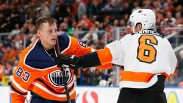 Oct 16, 2019; Edmonton, Alberta, CAN; Edmonton Oilers defensemen Matt Benning (83) and Philadelphia Flyers defensemen Travis Sanheim (6) scuffle after a whistle during the third period at Rogers Place. Mandatory Credit: Perry Nelson-USA TODAY Sports