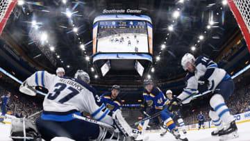 ST. LOUIS, MO - FEBRUARY 23: Connor Hellebuyck #37 of the Winnipeg Jets and Bryan Little #18 of the Winnipeg Jets defend against Vladimir Sobotka #71 of the St. Louis Blues and Ivan Barbashev #49 of the St. Louis Blues at Scottrade Center on February 23, 2018 in St. Louis, Missouri. (Photo by Scott Rovak/NHLI via Getty Images)
