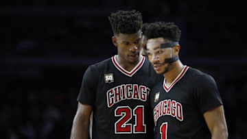 Oct 30, 2015; Auburn Hills, MI, USA; Chicago Bulls guard Jimmy Butler (21) talks to guard Derrick Rose (1) during overtime against the Detroit Pistons at The Palace of Auburn Hills. The Pistons won 98-94. Mandatory Credit: Raj Mehta-USA TODAY Sports