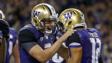 Sep 30, 2016; Seattle, WA, USA; Washington Huskies quarterback Jake Browning (3) celebrates with wide receiver Aaron Fuller (12) after a three-yard touchdown pass from Browning to Fuller during the second half at Husky Stadium. Washington won 44-6. Mandatory Credit: Jennifer Buchanan-USA TODAY Sports