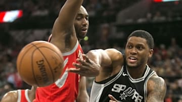 SAN ANTONIO,TX - APRIL 1 : Rudy Gay #22 of the San Antonio Spurs passes off in front of Luc Mbah a Moute #12 of the Houston Rockets at AT&T Center on April 1 , 2018 in San Antonio, Texas. NOTE TO USER: User expressly acknowledges and agrees that , by downloading and or using this photograph, User is consenting to the terms and conditions of the Getty Images License Agreement. (Photo by Ronald Cortes/Getty Images)
