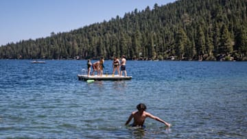 SOUTH LAKE TAHOE, CA - AUGUST 9: Kids enjoy a sunny day at Fallen Leaf Lake, located adjacent to Lake Tahoe near Emerald Bay, on August 9, 2020, in South Lake Tahoe, California. Lake Tahoe has proven to be a major destination this summer for Covid-19 weary tourists hoping to trade the pandemic for the clean air, camping, and water sports found at this Sierra Nevada Mountain Range high altitude lake. (Photo by George Rose/Getty Images)