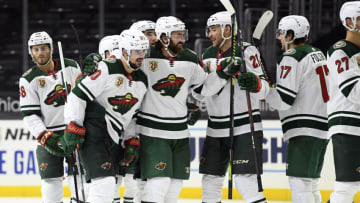 LOS ANGELES, CALIFORNIA - JANUARY 16: Marcus Johansson #90 of the Minnesota Wild celebrates his game winning goal with Greg Pateryn #29 and Carson Soucy #21 during a 4-3 overtime win over the Los Angeles Kings at Staples Center on January 16, 2021 in Los Angeles, California. (Photo by Harry How/Getty Images)