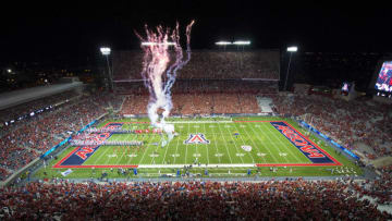 TUCSON, AZ - SEPTEMBER 13: The Arizona Wildcats take the field with fireworks to start the game against the Nevada Wolf Pack at Arizona Stadium on September 13, 2014 in Tucson, Arizona. (Photo by Paul Dye/J and L Photography/Getty Images )