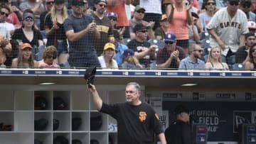 SAN DIEGO, CA - JULY 28: Bruce Bochy #15 of the San Francisco Giants tips his cap to the fans during the third inning of a baseball game against the San Diego Padres at Petco Park July 28, 2019 in San Diego, California. The game will be the last time he manages at Petco Park before his retirement. (Photo by Denis Poroy/Getty Images)