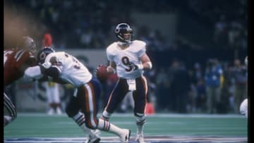 26 Jan 1986: Quarterback Jim McMahon of the Chicago Bears looks to pass the ball against the New England Patriots during Super Bowl XX at the Superdome in New Orleans, Louisiana. The Bears won the game, 46-10.