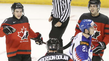 VICTORIA , BC - DECEMBER 21: Nick Suzuki #17 of Team Canada celebrates a goal with teammates Jaret Anderson-Dolan #11 and Evan Bouchard #2 as Adam Ruika #21 of Team Slovakia skates to the bench at the IIHF World Junior Championships at the Save-on-Foods Memorial Centre on December 21, 2018 in Victoria, British Columbia, Canada. (Photo by Kevin Light/Getty Images)