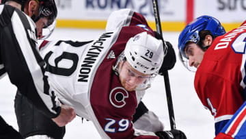 MONTREAL, QC - JANUARY 12: Nathan MacKinnon #29 of the Colorado Avalanche takes a face-off against Phillip Danault #24 of the Montreal Canadiens during the NHL game at the Bell Centre on January 12, 2019 in Montreal, Quebec, Canada. The Montreal Canadiens defeated the Colorado Avalanche 3-0. (Photo by Minas Panagiotakis/Getty Images)