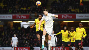 WATFORD, ENGLAND - DECEMBER 26: Harry Maguire of Leicester City jumps for a header with Marvin Zeegelaar of Watford during the Premier League match between Watford and Leicester City at Vicarage Road on December 26, 2017 in Watford, England. (Photo by Michael Regan/Getty Images)